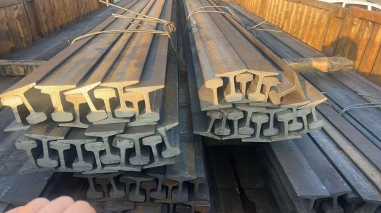 Bundled railway steel rails arranged for transportation Bundled railway steel rails arranged for transportation